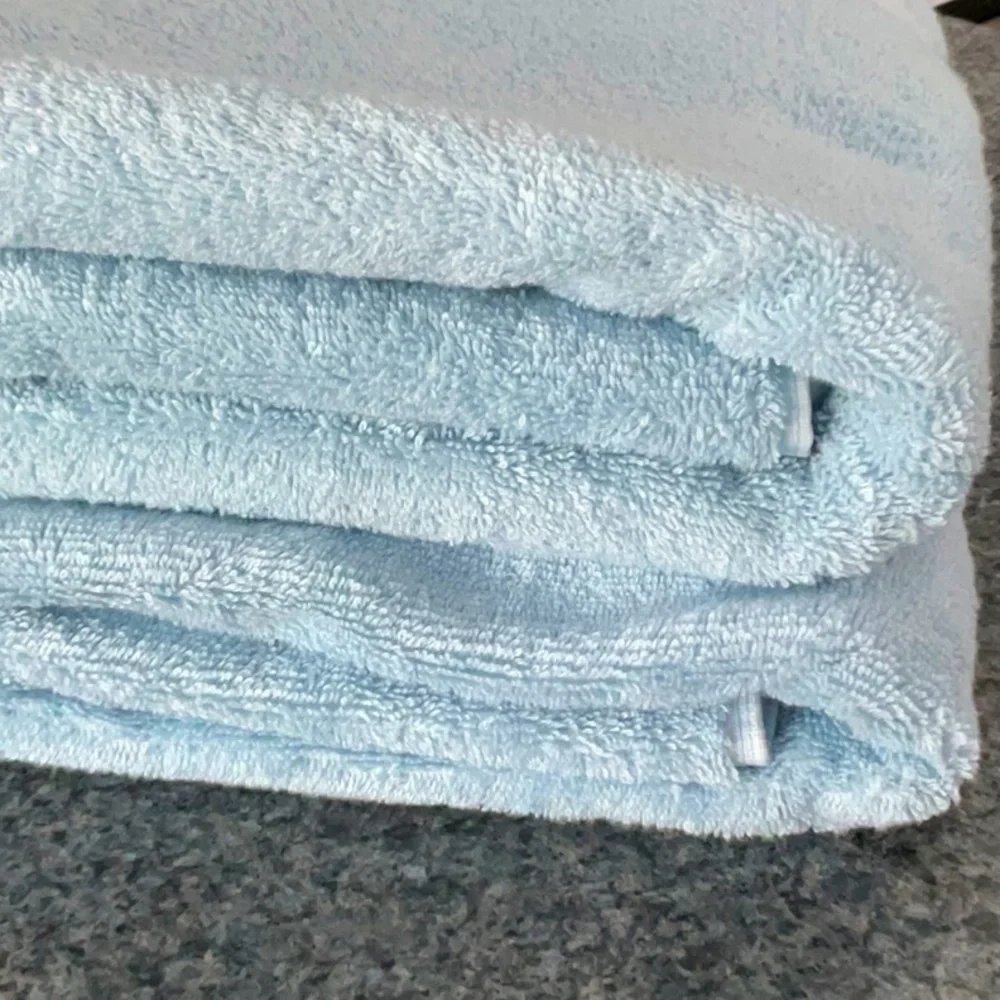 Martha Stewart set of 2 hygrocotton bath towels. Color is Angel Falls blue.